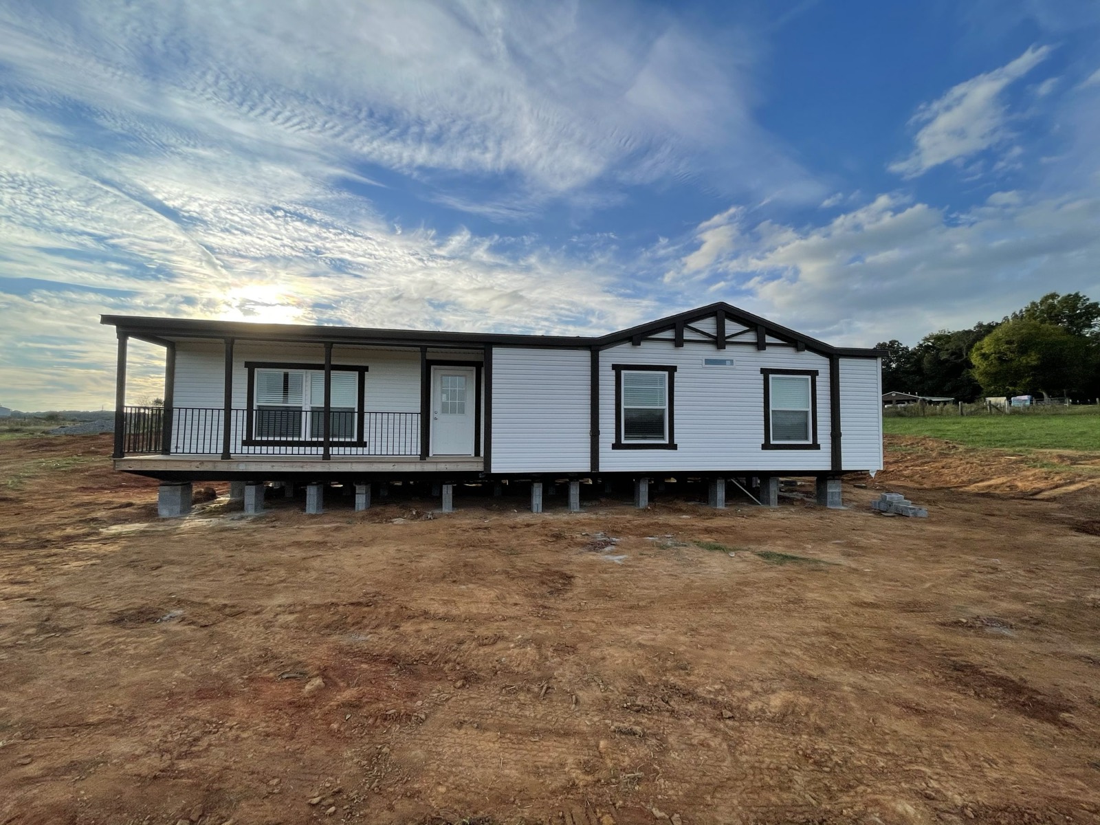 Finished graded dirt pad at sunset